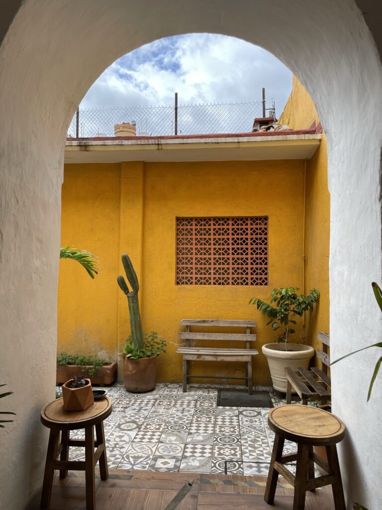 Coffee shop in Oaxaca with burnt yellow wall